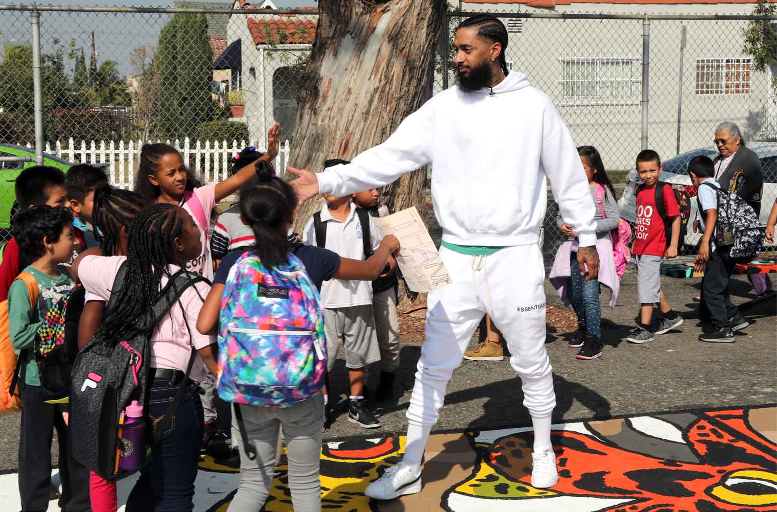 Nipsey Hussle with students